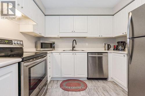 103 - 245 Queen Street W, Centre Wellington, ON - Indoor Photo Showing Kitchen With Double Sink