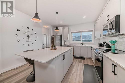 114 Midgrove Greenway Sw, Airdrie, AB - Indoor Photo Showing Kitchen With Upgraded Kitchen