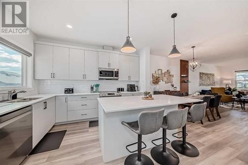 114 Midgrove Greenway Sw, Airdrie, AB - Indoor Photo Showing Kitchen With Double Sink With Upgraded Kitchen