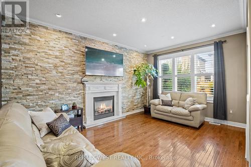 17 Hawkridge Trail, Brampton, ON - Indoor Photo Showing Living Room With Fireplace