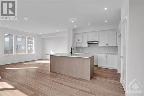 Kitchen with large island and bar style seating - 995 Acoustic Way, Ottawa, ON - Indoor Photo Showing Kitchen