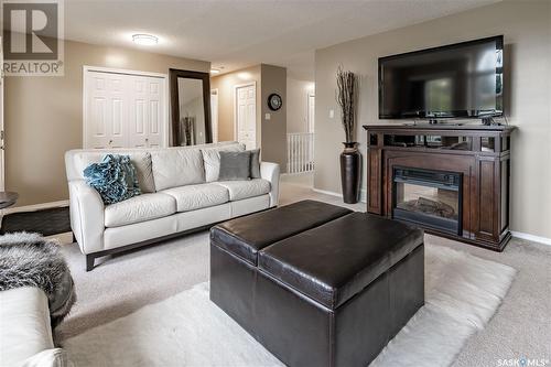 110 Hogg Crescent, Saskatoon, SK - Indoor Photo Showing Living Room With Fireplace