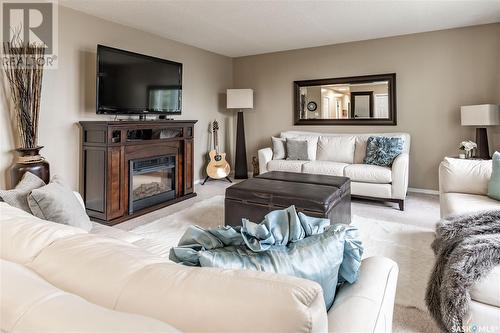 110 Hogg Crescent, Saskatoon, SK - Indoor Photo Showing Living Room With Fireplace