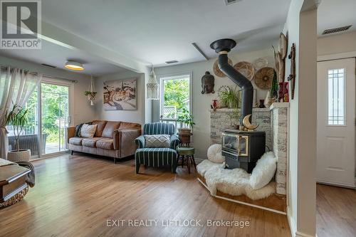 6 Woods Avenue, Kawartha Lakes, ON - Indoor Photo Showing Living Room With Fireplace