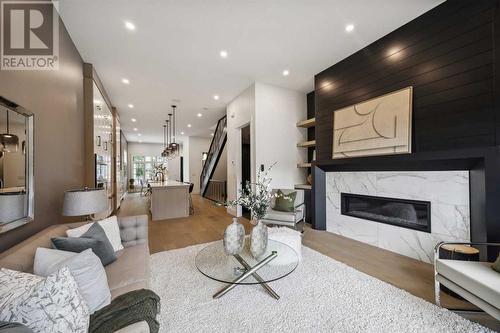 Great room w/fireplace - 528 19 Avenue Sw, Calgary, AB - Indoor Photo Showing Living Room With Fireplace