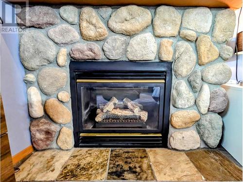 2060 Summit Drive Unit# 104, Panorama, BC - Indoor Photo Showing Living Room With Fireplace