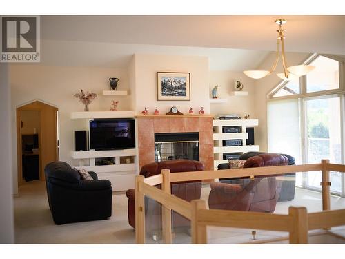 307 Sandpiper Court, Kelowna, BC - Indoor Photo Showing Other Room With Fireplace