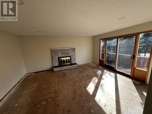 1772 Cypress Road, Quesnel, BC - Indoor Photo Showing Living Room With Fireplace