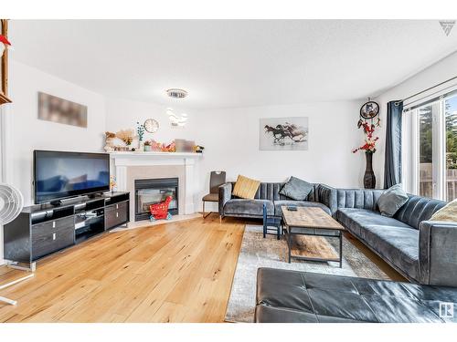 4123 22 Av Nw, Edmonton, AB - Indoor Photo Showing Living Room With Fireplace