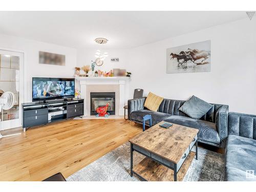 4123 22 Av Nw, Edmonton, AB - Indoor Photo Showing Living Room With Fireplace