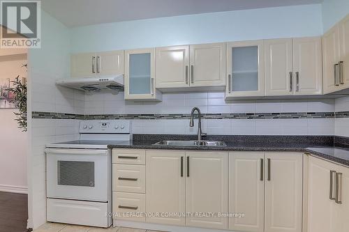 405 - 2550 Pharmacy Avenue, Toronto, ON - Indoor Photo Showing Kitchen With Double Sink