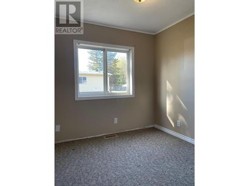 8 2963 Klahannie Drive, Fort Nelson, BC - Indoor Photo Showing Other Room