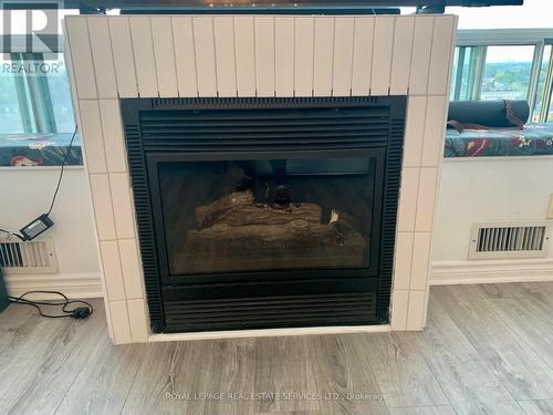 721 - 250 Manitoba Street, Toronto (Mimico), ON - Indoor Photo Showing Living Room With Fireplace