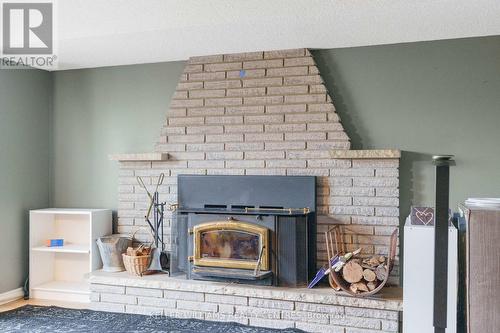 16 Gosney Crescent W, Barrie, ON - Indoor Photo Showing Living Room With Fireplace