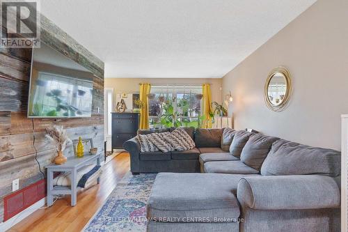 16 Gosney Crescent W, Barrie, ON - Indoor Photo Showing Living Room With Fireplace