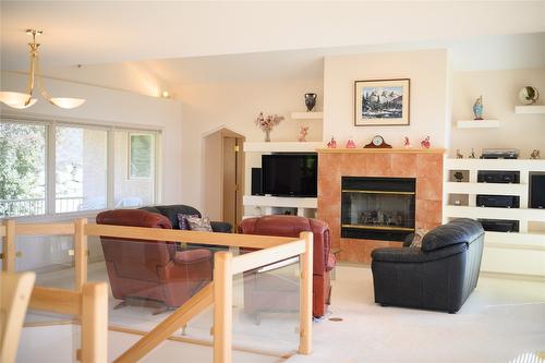 307 Sandpiper Court, Kelowna, BC - Indoor Photo Showing Living Room With Fireplace