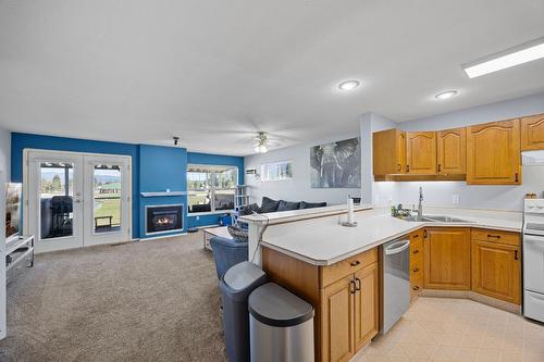 27-303 Regent Avenue, Enderby, BC - Indoor Photo Showing Kitchen With Fireplace With Double Sink