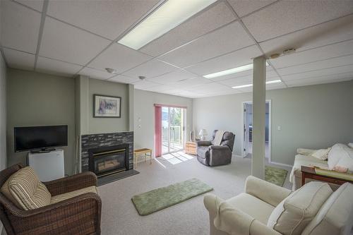 5247 Sutherland Road, Peachland, BC - Indoor Photo Showing Other Room With Fireplace