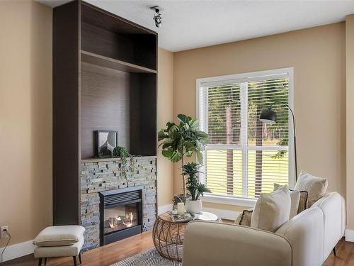 405-1400 Lynburne Pl, Langford, BC - Indoor Photo Showing Living Room With Fireplace