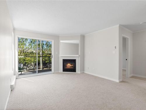 201-1039 Caledonia Ave, Victoria, BC - Indoor Photo Showing Living Room With Fireplace