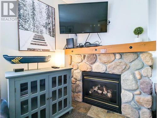 2060 Summit  Drive Unit# 403, Panorama, BC - Indoor Photo Showing Living Room With Fireplace