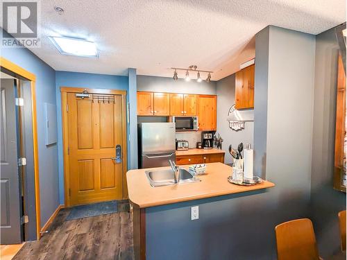 2060 Summit  Drive Unit# 208, Panorama, BC - Indoor Photo Showing Kitchen With Double Sink