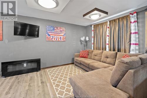 8485 Darlington Crescent, Windsor, ON - Indoor Photo Showing Living Room With Fireplace