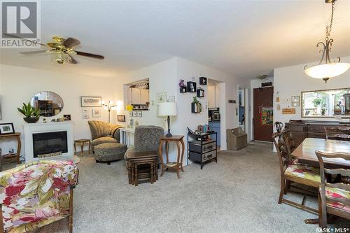 304 525 5Th Avenue N, Saskatoon, SK - Indoor Photo Showing Living Room With Fireplace