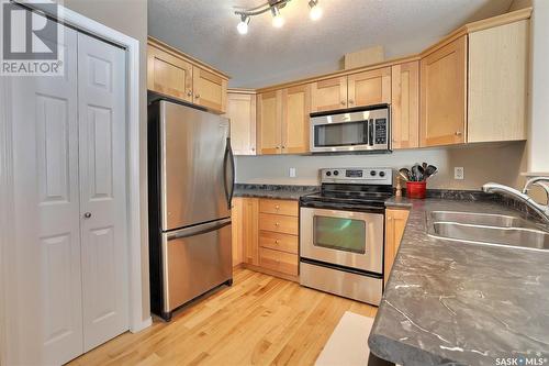 14 2751 Windsor Park Road, Regina, SK - Indoor Photo Showing Kitchen With Double Sink