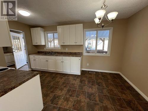 3904 E 53 Avenue, Fort Nelson, BC - Indoor Photo Showing Kitchen With Double Sink