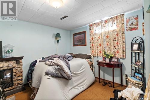 609 King Street, Imperial, SK - Indoor Photo Showing Bedroom With Fireplace