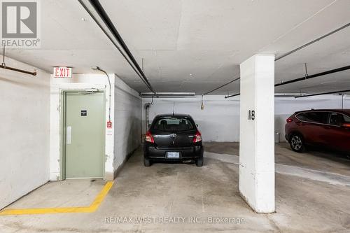 320 - 6 Humberline Drive, Toronto, ON - Indoor Photo Showing Garage