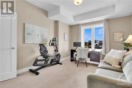 Bedroom two large enough for den, office or bedroom - 615 Longfields Drive Unit#302, Ottawa, ON - Indoor Photo Showing Gym Room