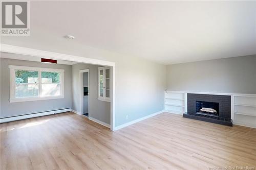 922 Smythe Street, Fredericton, NB - Indoor Photo Showing Living Room With Fireplace