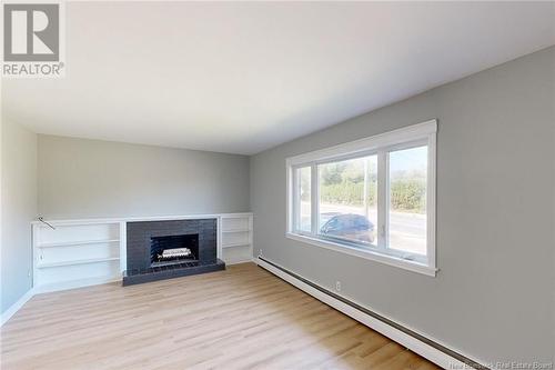 922 Smythe Street, Fredericton, NB - Indoor Photo Showing Living Room With Fireplace