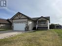 5617 Birch Drive, Fort Nelson, BC  - Outdoor With Deck Patio Veranda With Facade 