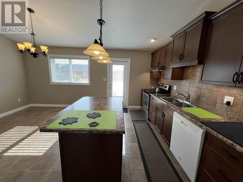 5617 Birch Drive, Fort Nelson, BC - Indoor Photo Showing Kitchen With Double Sink