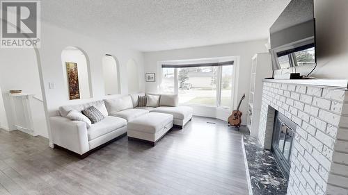 11204 106 Street, Fort St. John, BC - Indoor Photo Showing Living Room With Fireplace