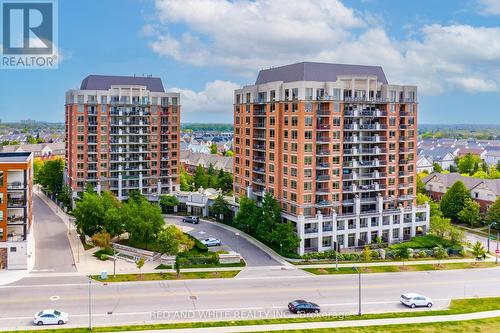 206 - 2379 Central Park Drive, Oakville, ON - Outdoor With Balcony With Facade