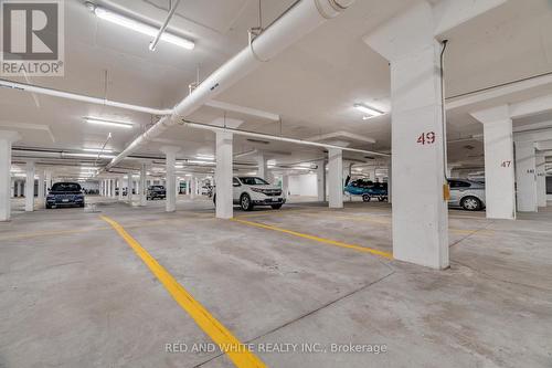 206 - 2379 Central Park Drive, Oakville, ON - Indoor Photo Showing Garage