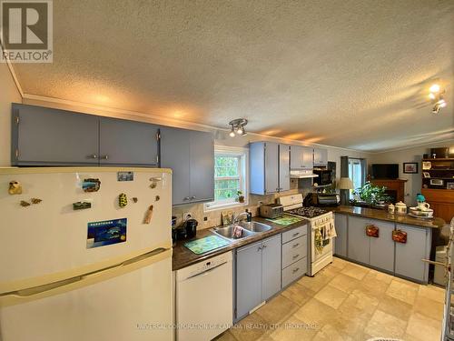 16 Grace Court, Bayham (Port Burwell), ON - Indoor Photo Showing Kitchen With Double Sink