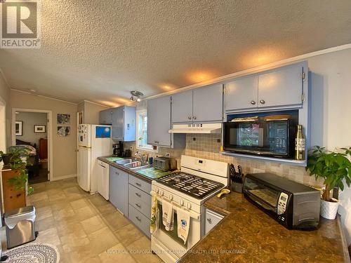 16 Grace Court, Bayham (Port Burwell), ON - Indoor Photo Showing Kitchen With Double Sink