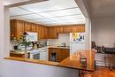 109-2085 Gordon Drive, Kelowna, BC  - Indoor Photo Showing Kitchen With Double Sink 