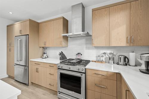 2-105 Predator Ridge Drive, Vernon, BC - Indoor Photo Showing Kitchen With Stainless Steel Kitchen