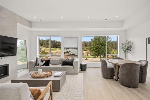 2-105 Predator Ridge Drive, Vernon, BC - Indoor Photo Showing Living Room With Fireplace