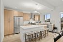 2-105 Predator Ridge Drive, Vernon, BC  - Indoor Photo Showing Kitchen With Stainless Steel Kitchen With Upgraded Kitchen 