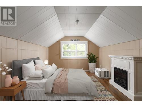 757 Coronation Avenue, Kelowna, BC - Indoor Photo Showing Bedroom With Fireplace