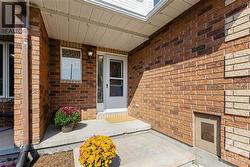 Step through the patio doors to discover a freshly sodded backyard with a gate leading to walking and biking paths for outdoor fun. - 