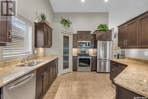 106 802 Heritage Crescent, Saskatoon, SK - Indoor Photo Showing Kitchen With Stainless Steel Kitchen With Double Sink