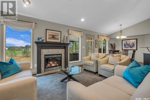 106 802 Heritage Crescent, Saskatoon, SK - Indoor Photo Showing Living Room With Fireplace